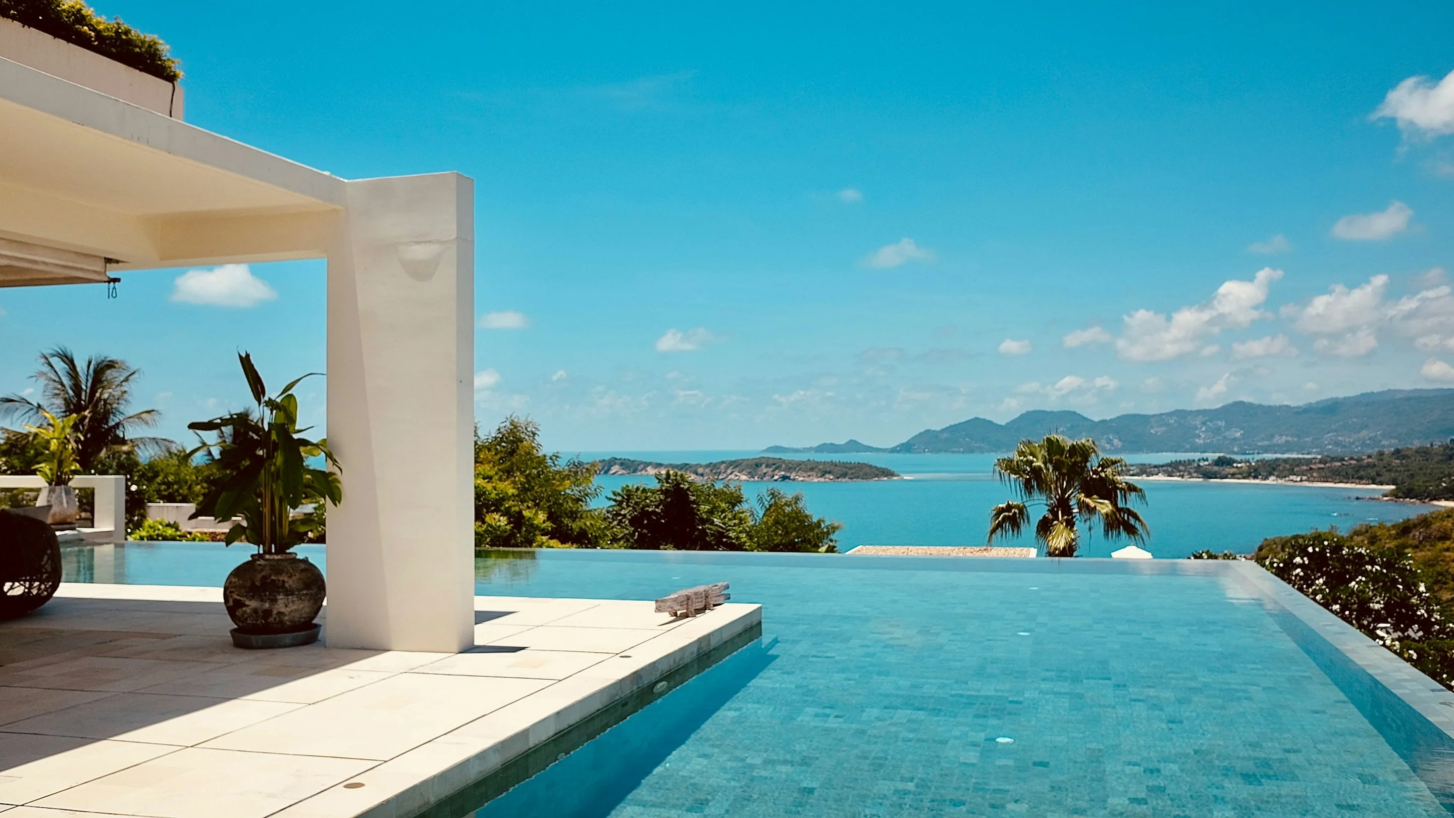 An infinity pool looking out over a bay